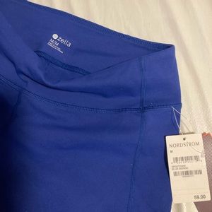 2 pairs of workout pants. Size M(blue)&L